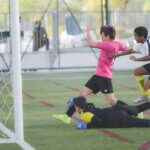 Child in Pink Kit Scoring A Goal