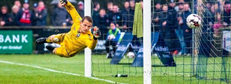 Premier League Relegation – Who’s going? Goalkeeper in Yellow Saving The Ball