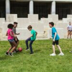 Friends Playing Football Together