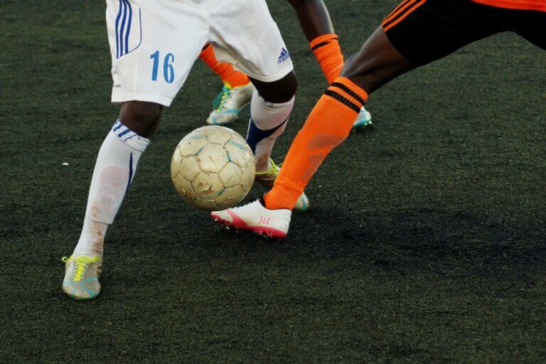 Top 6 Kids Football Shin Pads Defender Tackling The Attacker at Football